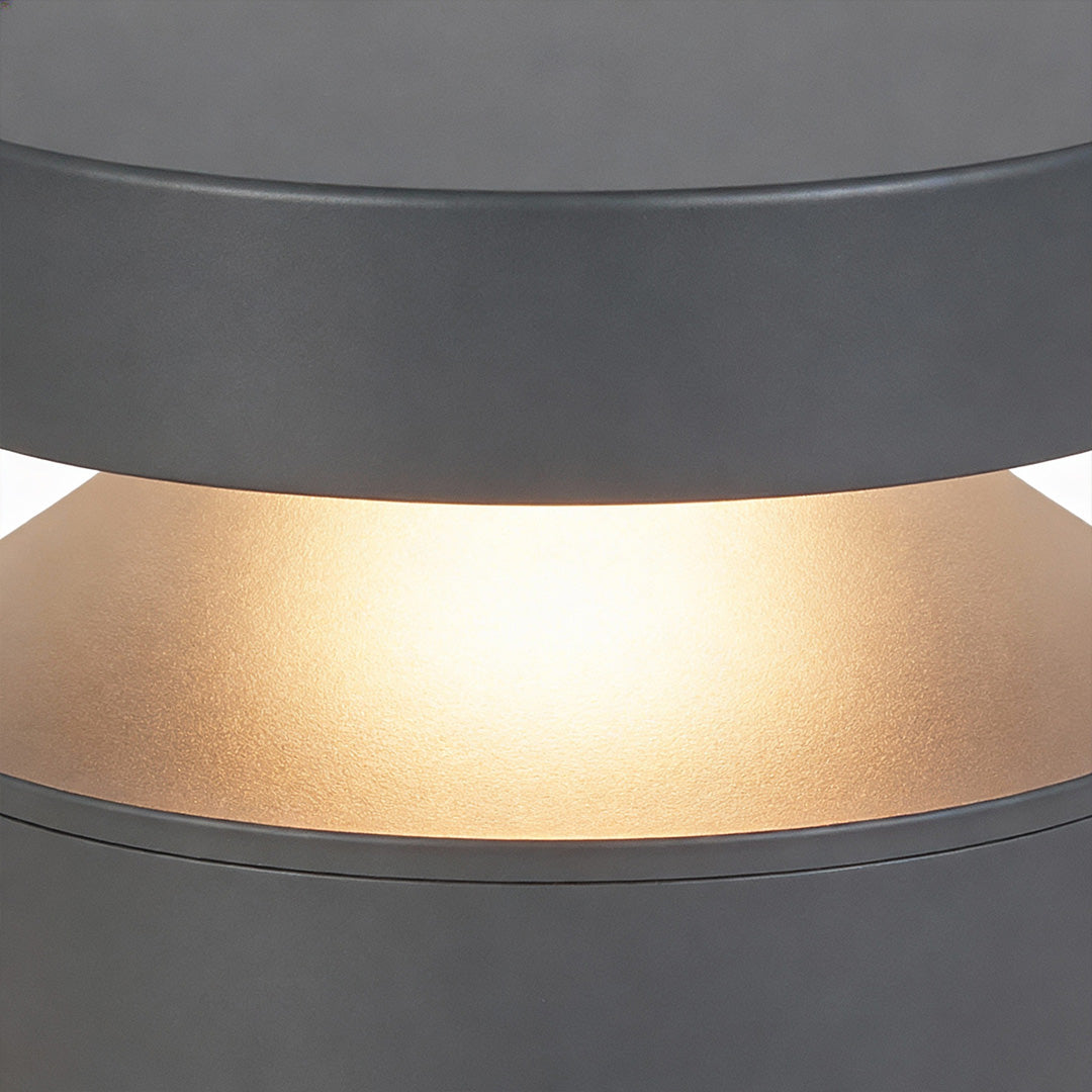 Detailed close up of the diffuser section on 110v landscape lights, emphasizing warm light output and material texture.