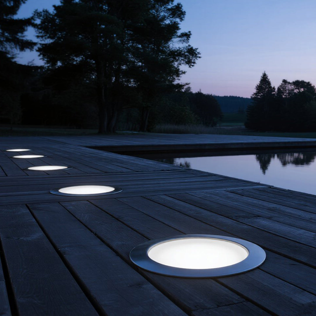 Luxury rooftop terrace with integrated deck lighting creating sophisticated urban evening atmosphere