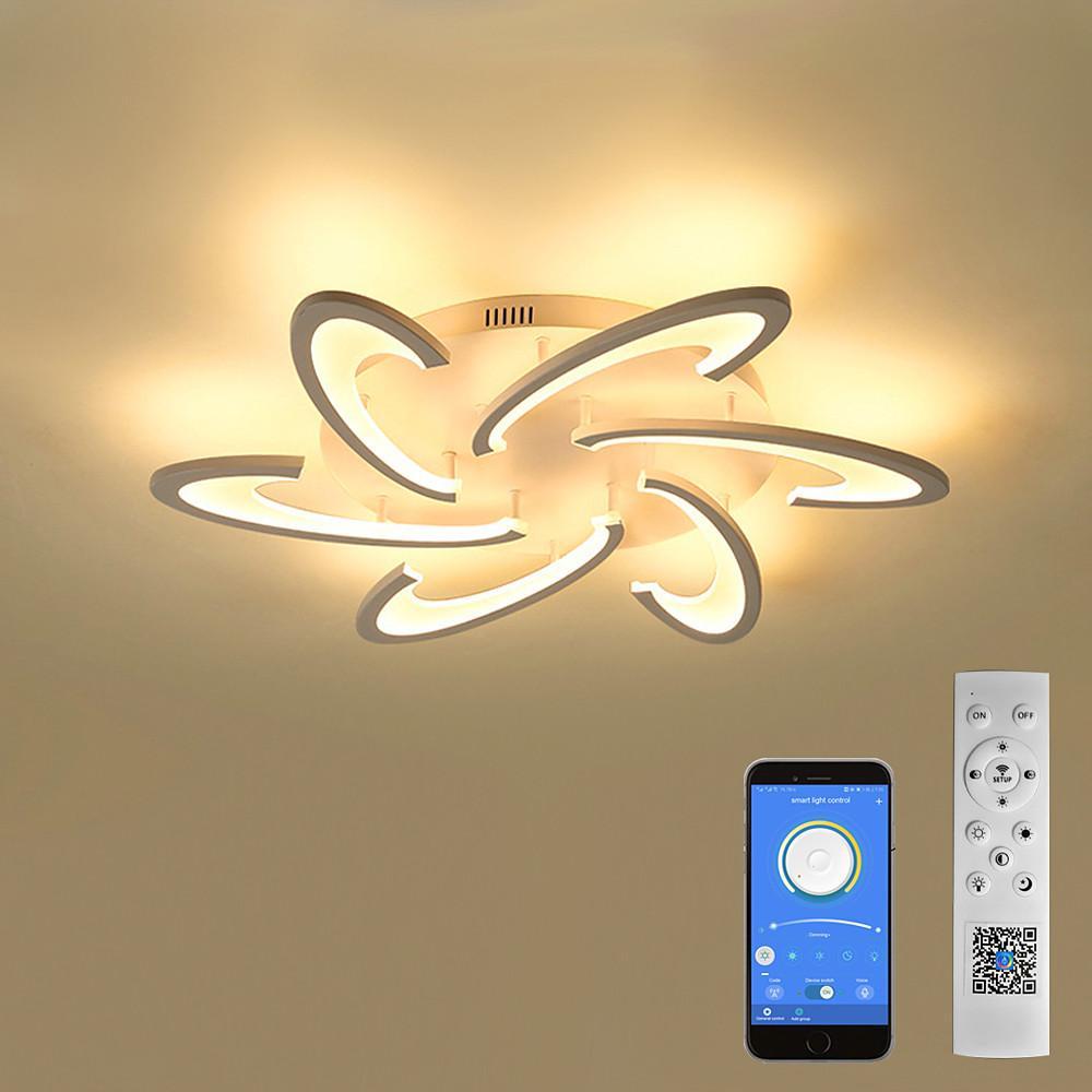 Curved LED ceiling light with warm glow and abstract modern shape.