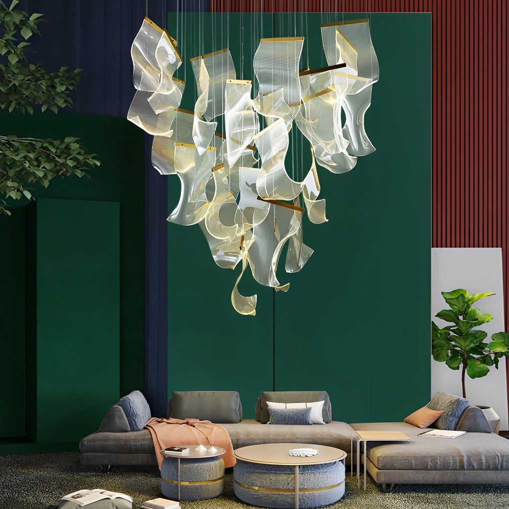 Acrylic chandeliers with a modern design, hanging above a dining table.