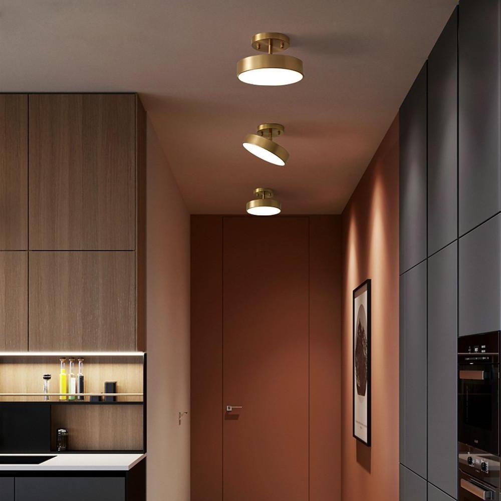 Modern adjustable LED ceiling lights installed in a kitchen corridor area.