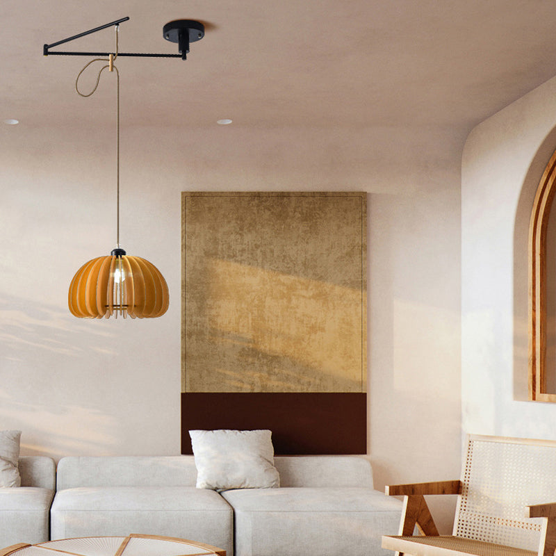 Adjustable pendant light fixture suspended in a lounge seating area