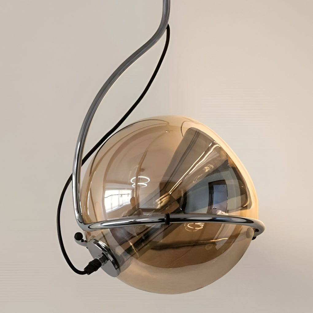 Amber glass globe pendant light product close-up highlighting internal bulb structure and glass texture.