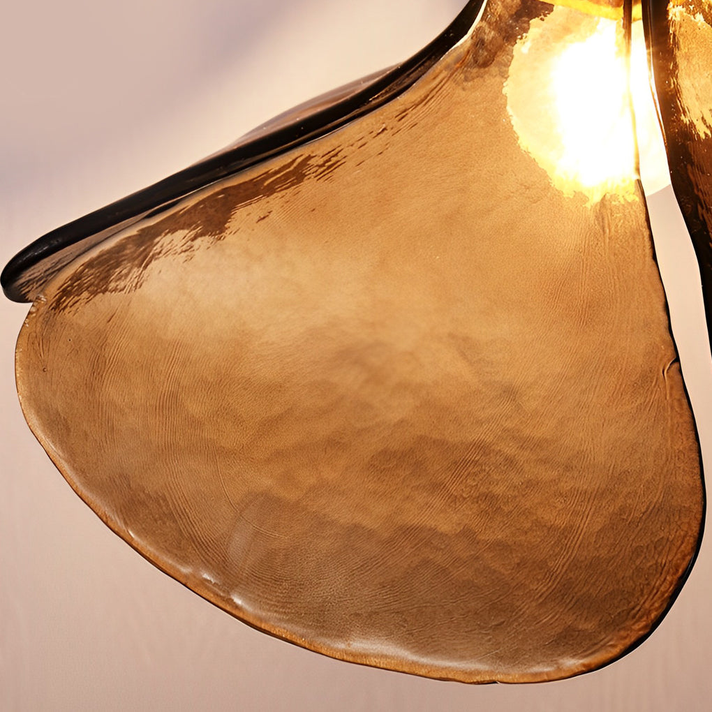 Amber glass pendant light with a close-up of the unique, handcrafted glass design.