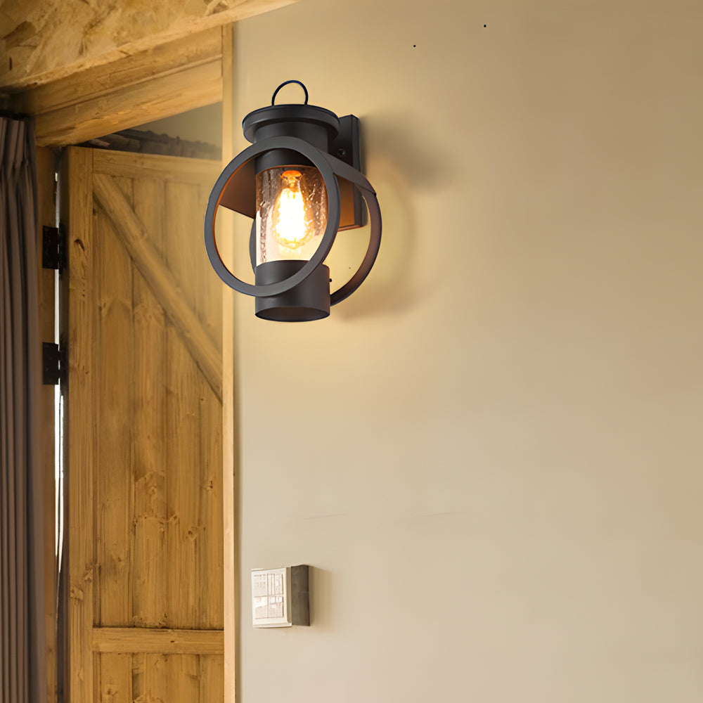 American outdoor wall sconce installed next to a rustic wooden door