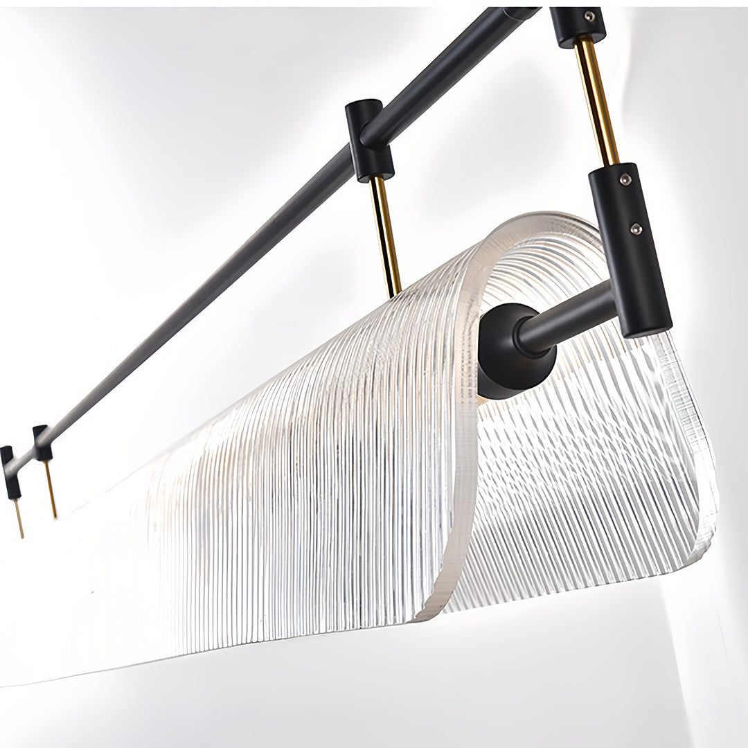 Angled view of linear light pendant displaying adjustable mounting mechanism with black framework.