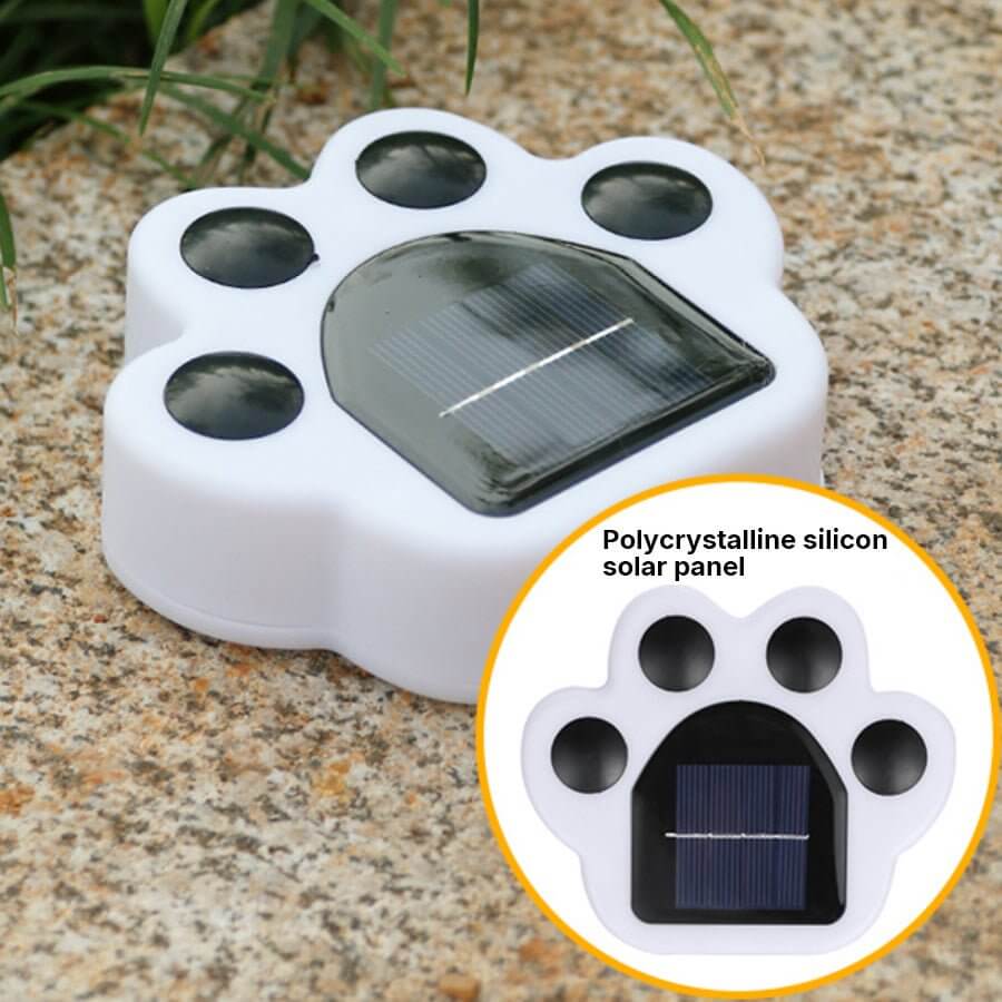 Animal paw step stairs light with a close-up of the solar panel and paw design.