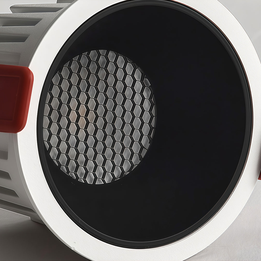 Detailed view of an anti-glare LED downlight recessed fixture, showing the deep black baffle and honeycomb mesh.