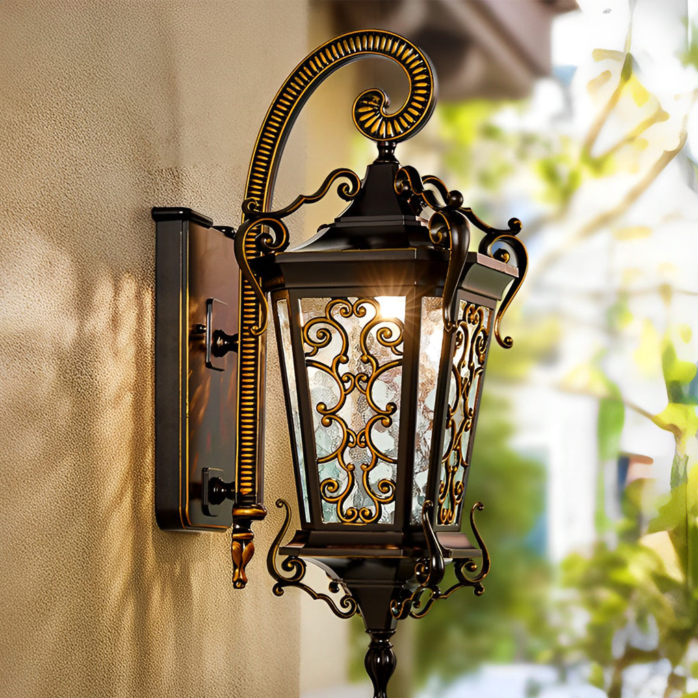 Antique outdoor wall lantern with classic silhouette mounted on exterior column in landscaped courtyard.