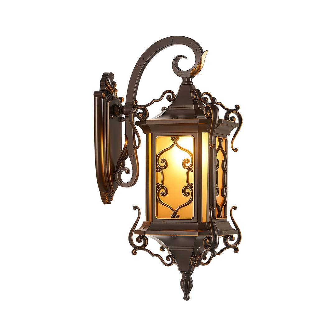 Antique outdoor wall sconce lights featuring intricate metal scrollwork and warm glow.