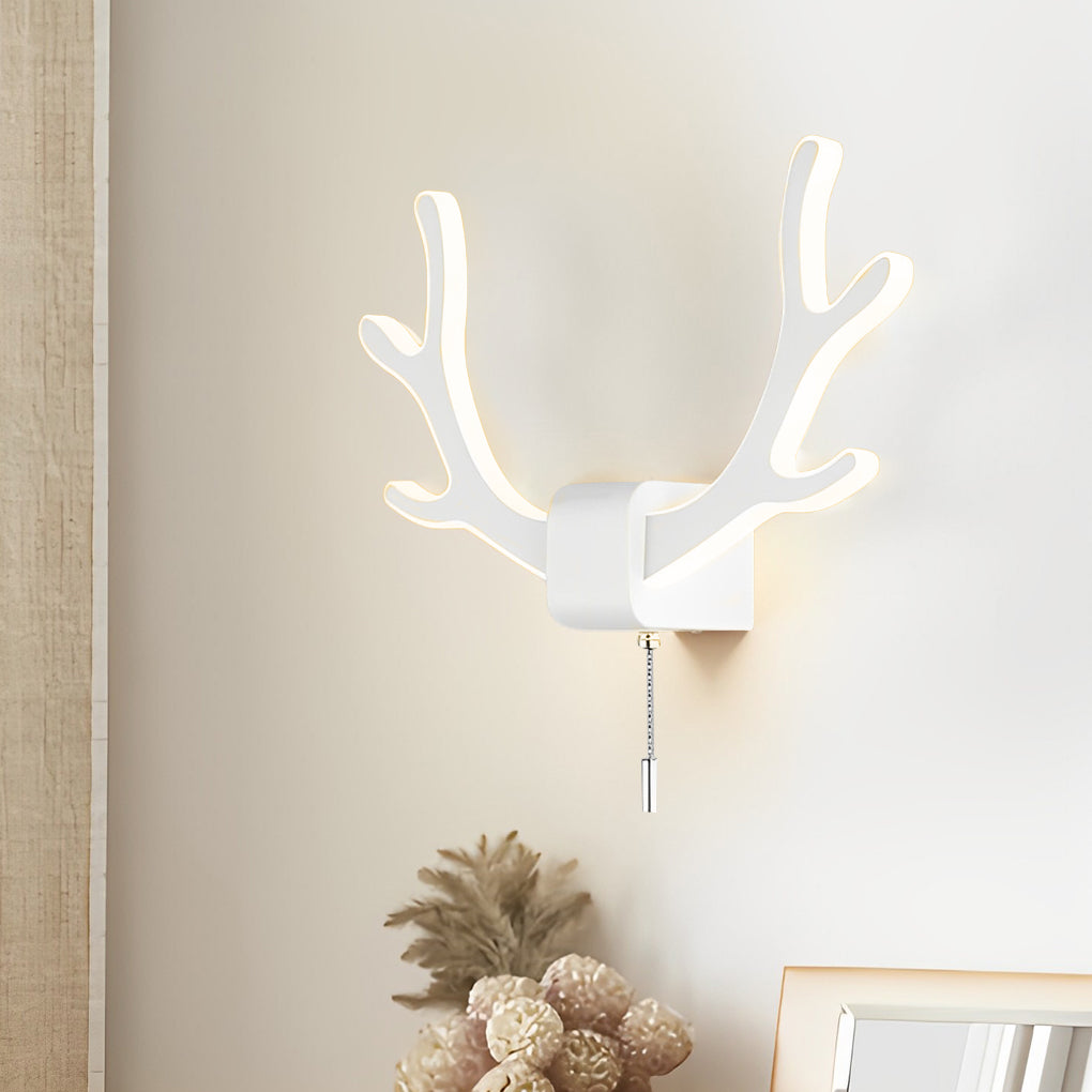 Antler wall sconce light in white finish mounted on a neutral wall, adding decorative lighting with an organic silhouette.