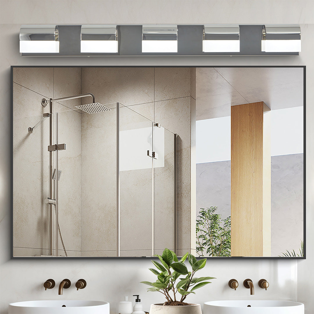 Architectural black vanity lighting for bathroom with glass shade chandelier aesthetic in rustic industrial bathroom setting.