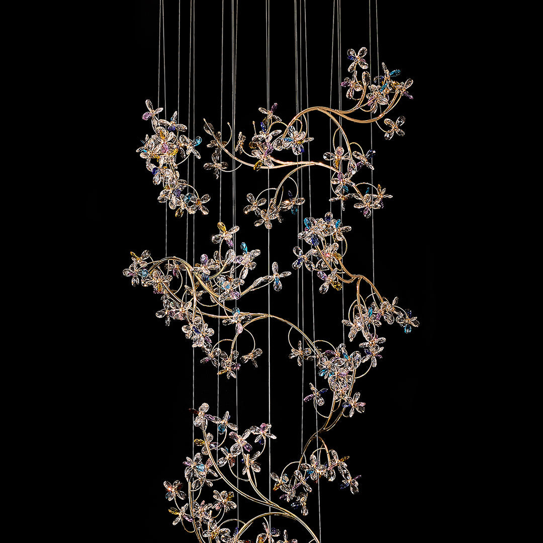 Architectural modern staircase chandelier featuring glass shade chandelier styling as dramatic statement piece in contemporary space with curved stairway.