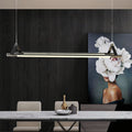Architectural linear pendant lights with clean horizontal lines enhancing contemporary home office design