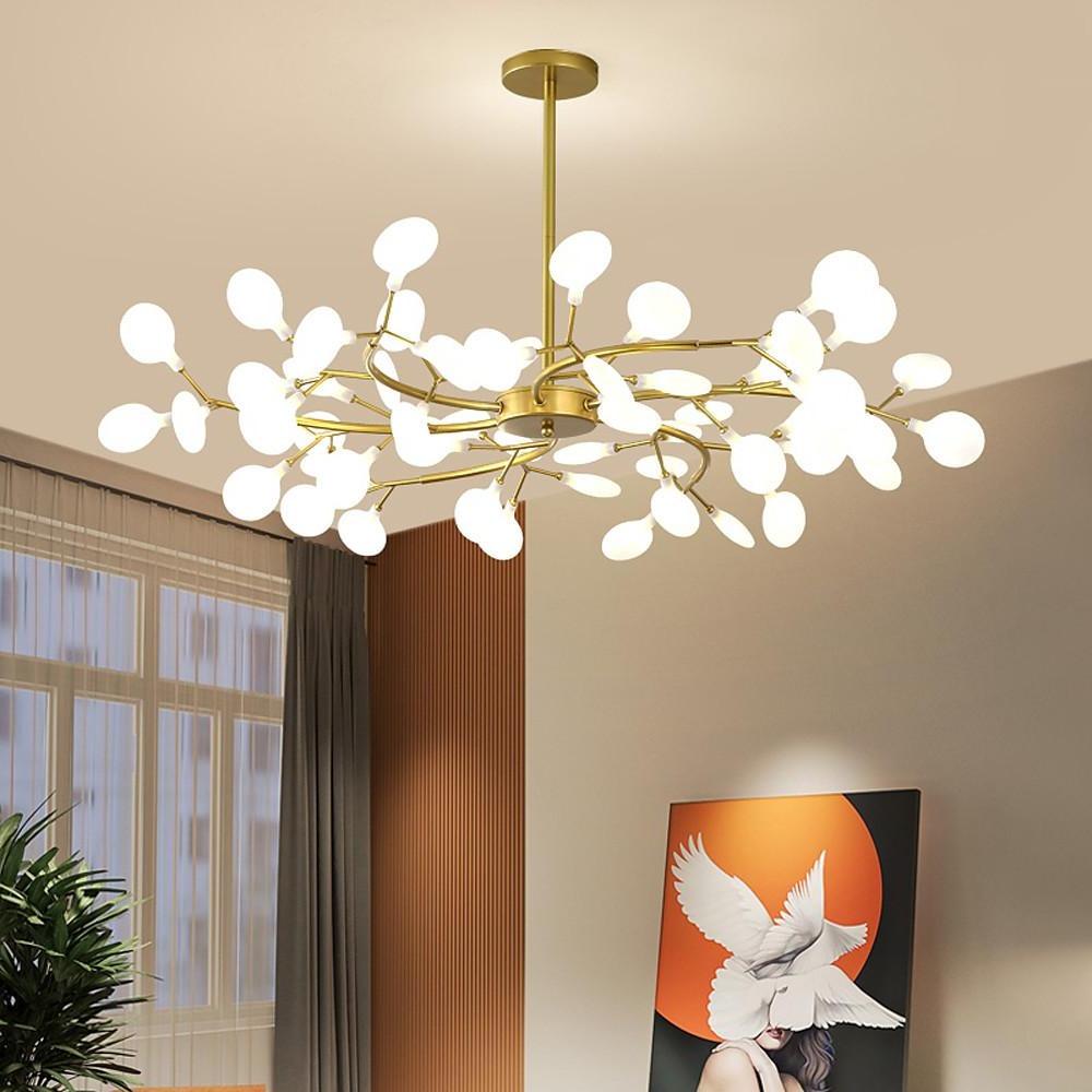Artistic firefly pendant light above round dining table.