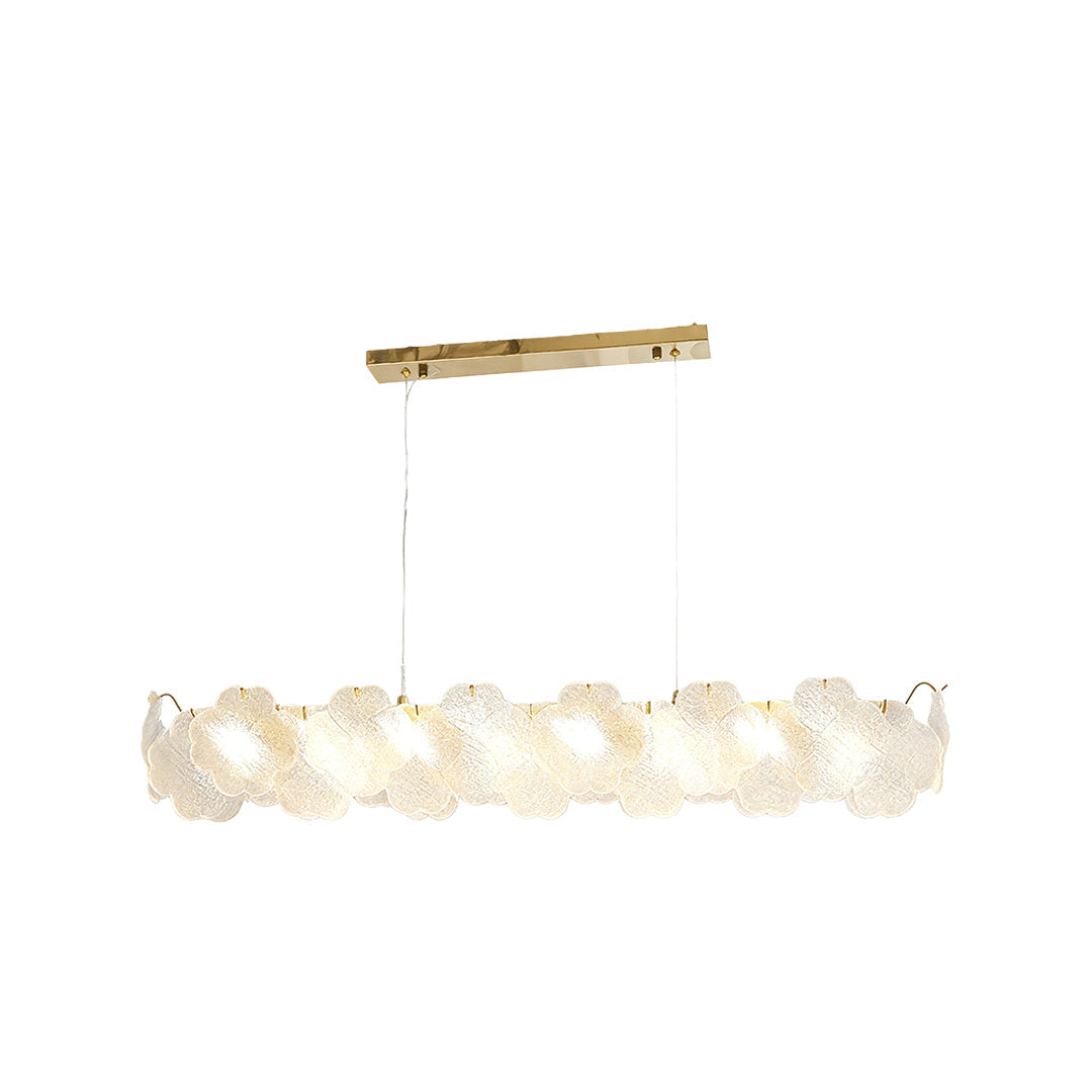 Artistic glass chandeliers hanging above a round table, creating a stylish focal point in a modern living space.