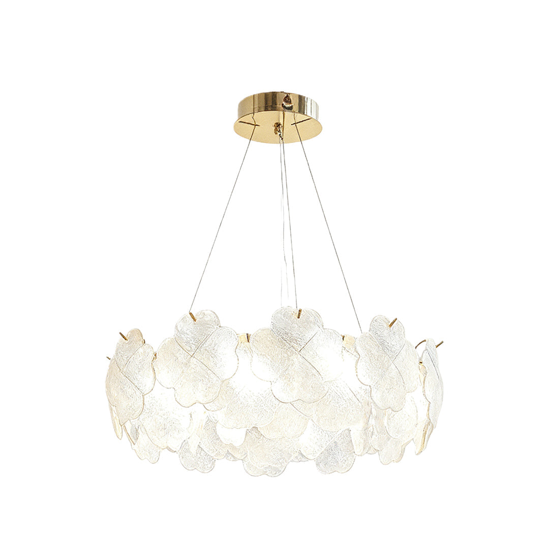 Artistic glass chandeliers installed in a sophisticated dining room, providing warm and ambient lighting.