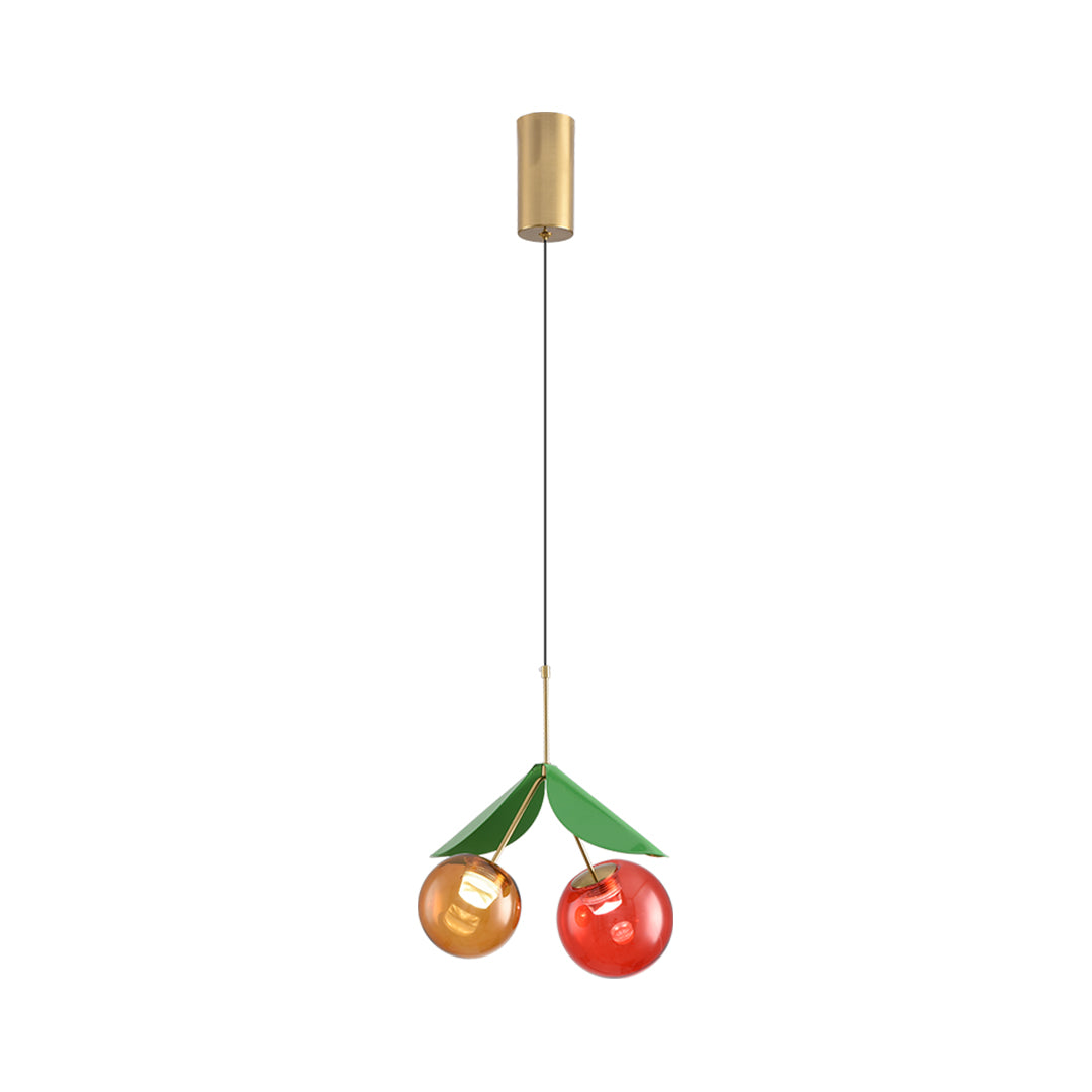 Artistic glass globe pendant light fixture with multiple cherry designs creating decorative cluster