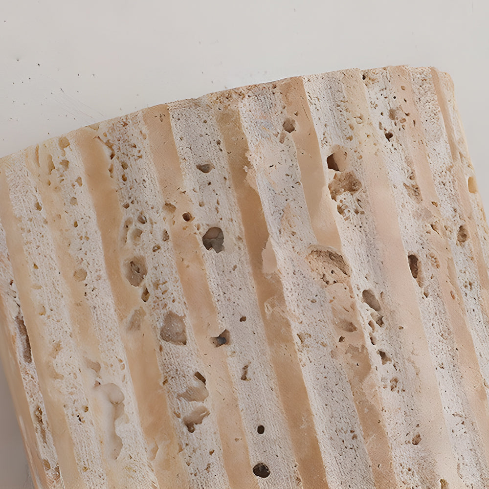 Close-up detail of natural travertine stone surface showing unique texture and mineral patterns