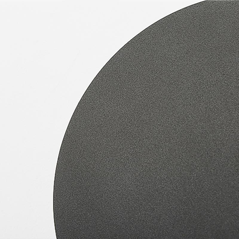 Textured metal surface detail of backlit wall light
