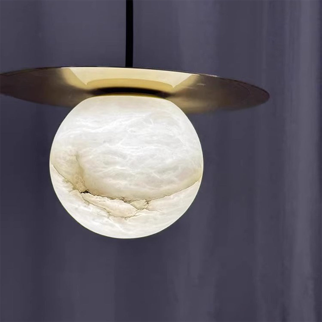 Close-up of a ball pendant light with a white marble sphere, highlighting its natural texture and modern design.