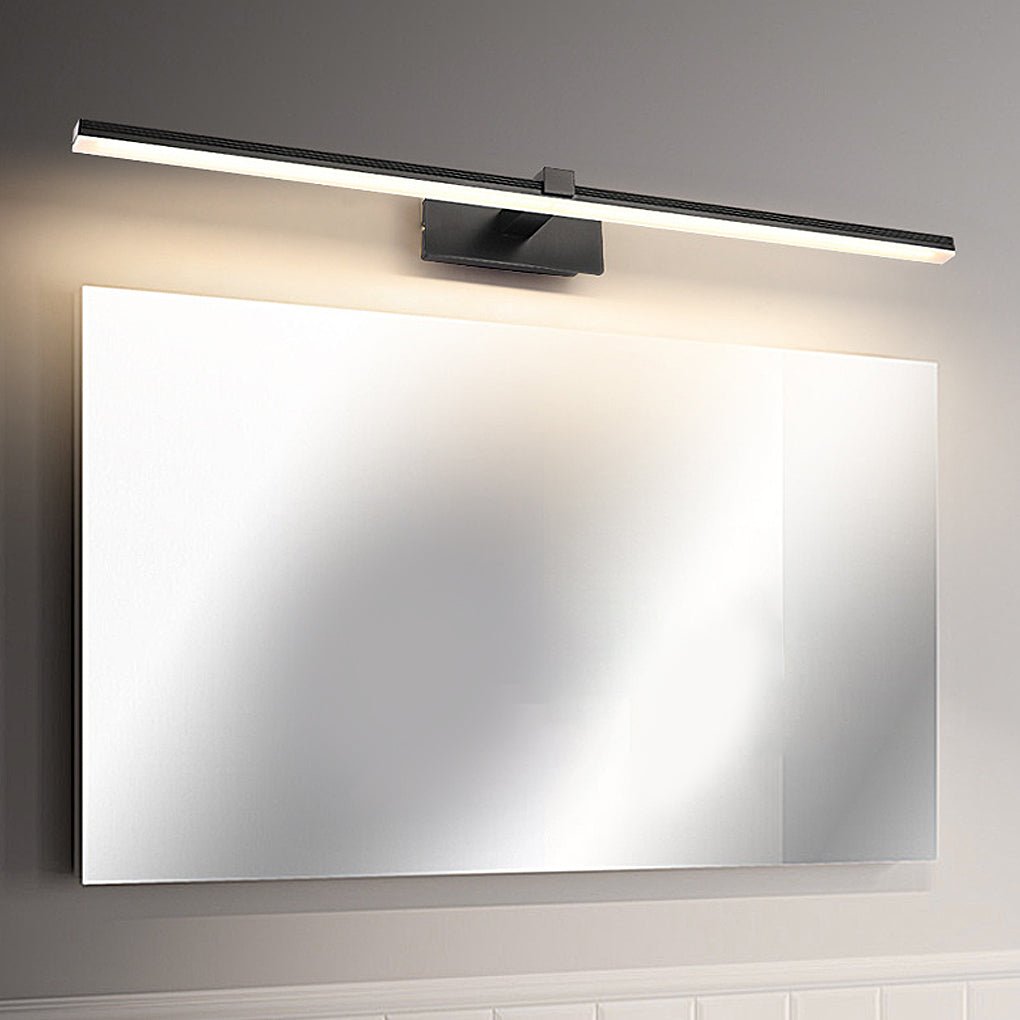 Large wall mirror evenly illuminated by modern bathroom lights above vanity.