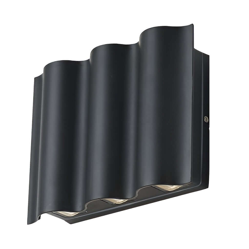 Black beam wall light with a wavy design, casting light beams on a white surface.