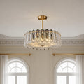 Beautiful glass semi flush mount lighting with a gold finish and vertical clear glass prisms.