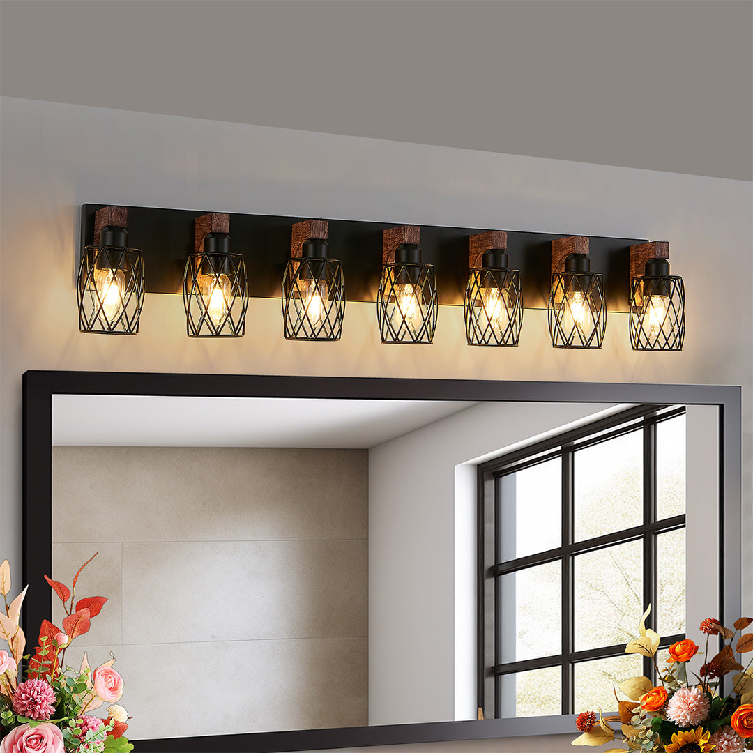 Black vanity bathroom light above a bedroom mirror, creating a warm and inviting atmosphere.