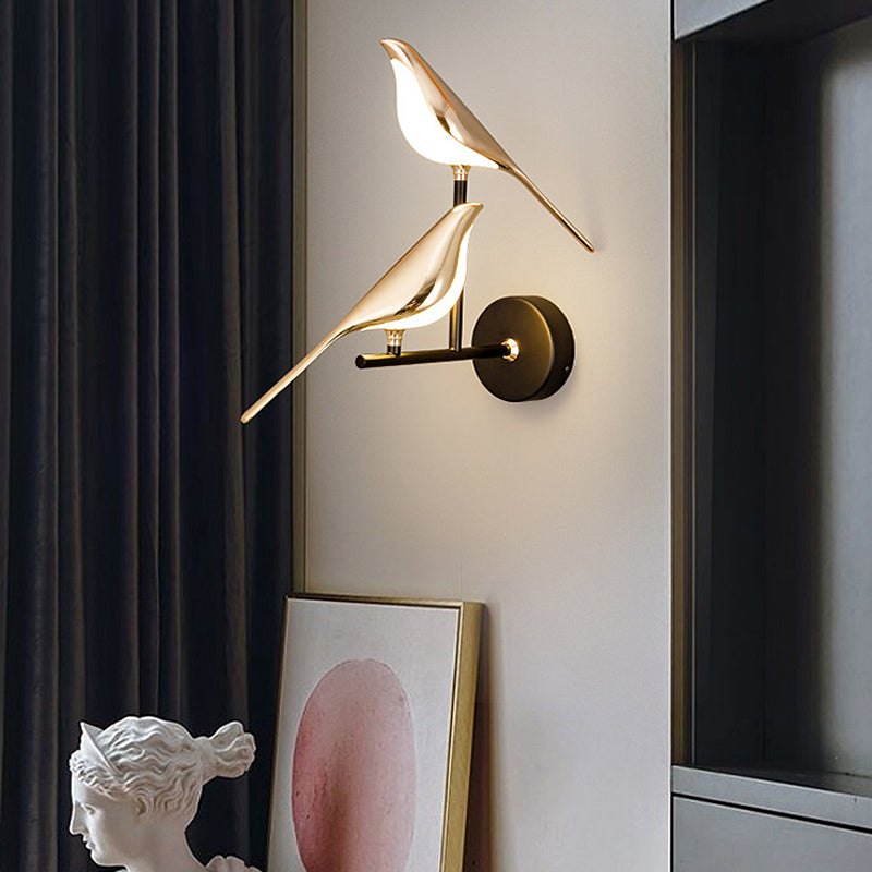 Bird wall light installed near dark curtains in a contemporary interior corner