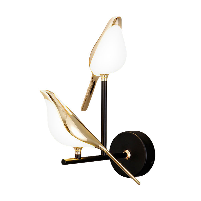 Bird wall light featuring a double bird design on a wall-mounted fixture