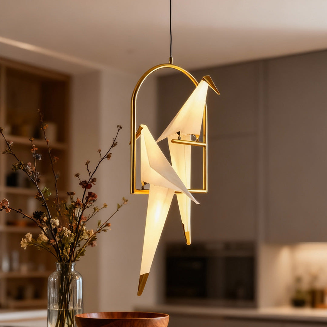 Bird wall light casting a golden glow in a stylish dining area with wooden tables.