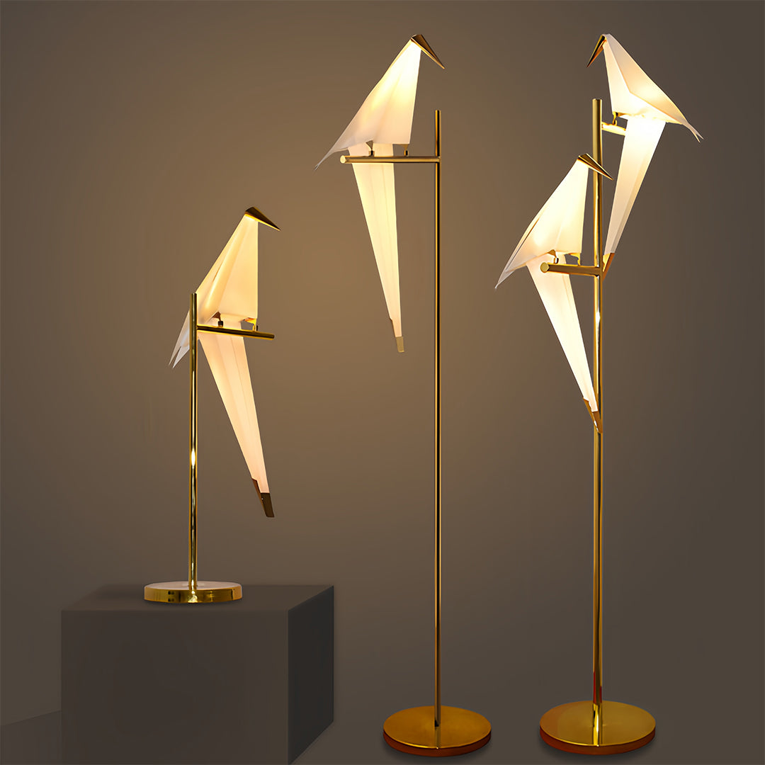 Bird wall light with a golden hoop, displayed against a white background.