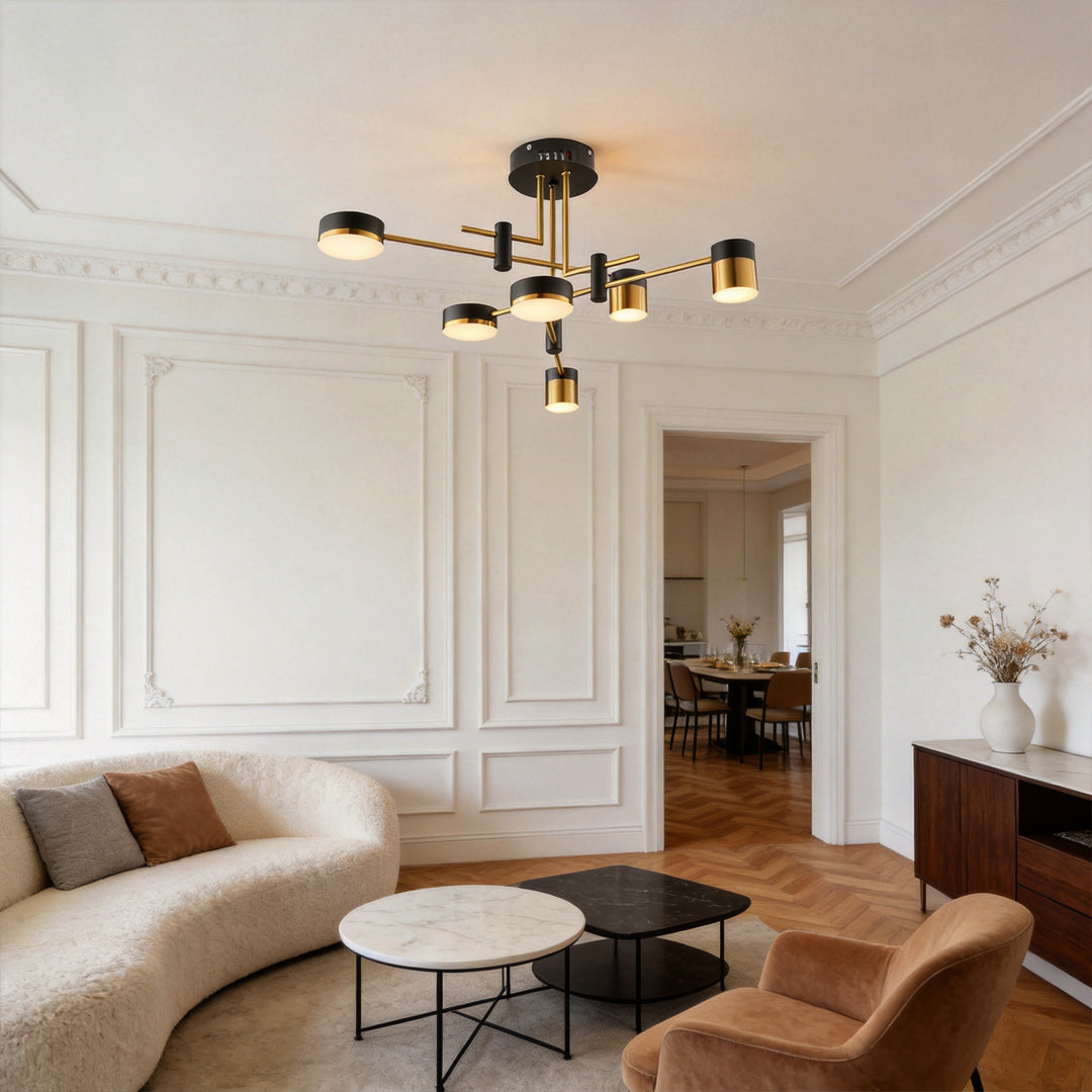Black and gold sputnik ceiling light installed in a modern living room with elegant wall paneling.