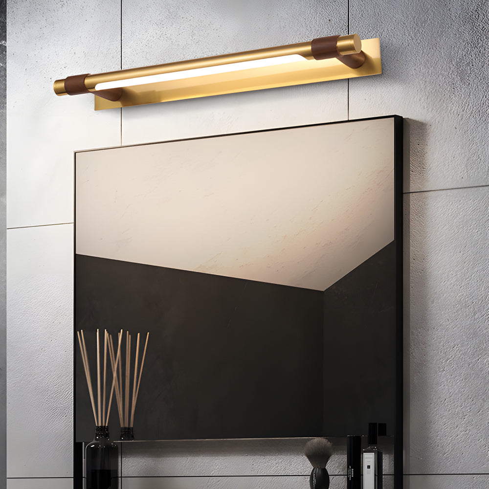 Black and gold vanity light illuminating a stylish bathroom with ambient light.