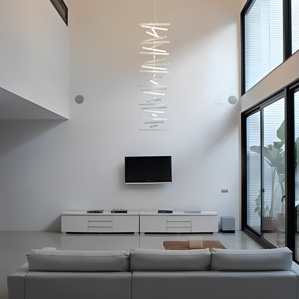 Black art pendants light fixture suspended above a dining table, blending art and functionality.