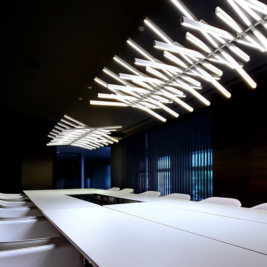 Black art pendants light illuminating a modern kitchen island, adding a touch of artistic flair.