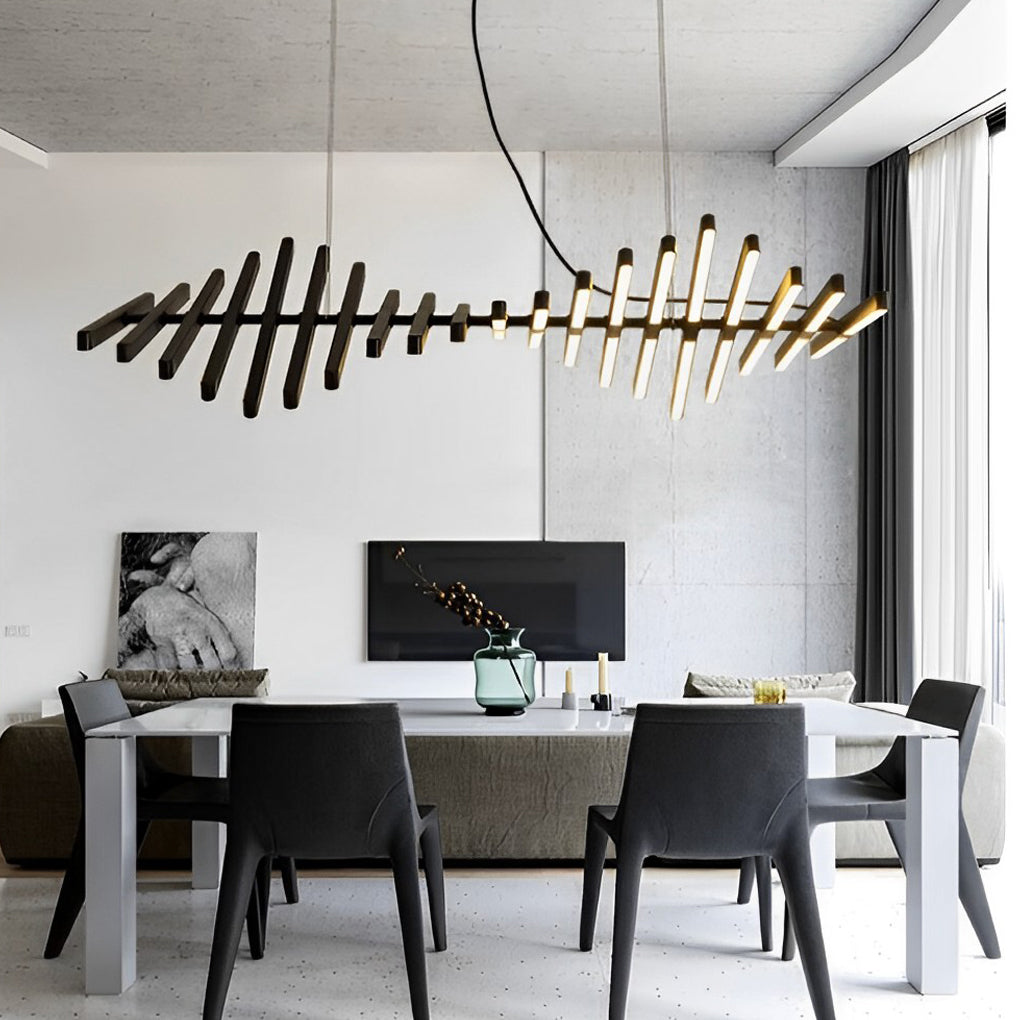 Black art pendants light with a sculptural design, creating a dramatic effect in a dining space.