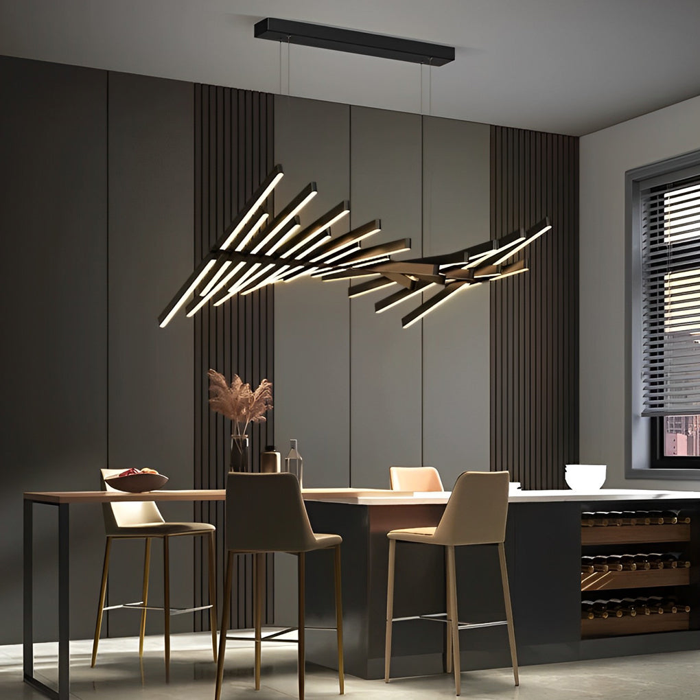 Black art pendants light casting warm illumination over a cozy dining setup with marble walls.