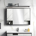 Black bar vanity light mounted above a modern bathroom mirror