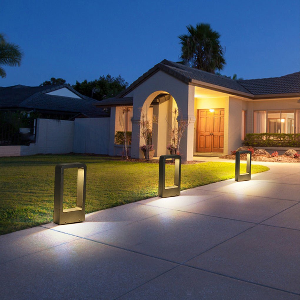Black bollard lights with a close-up of the rectangular light fixture.