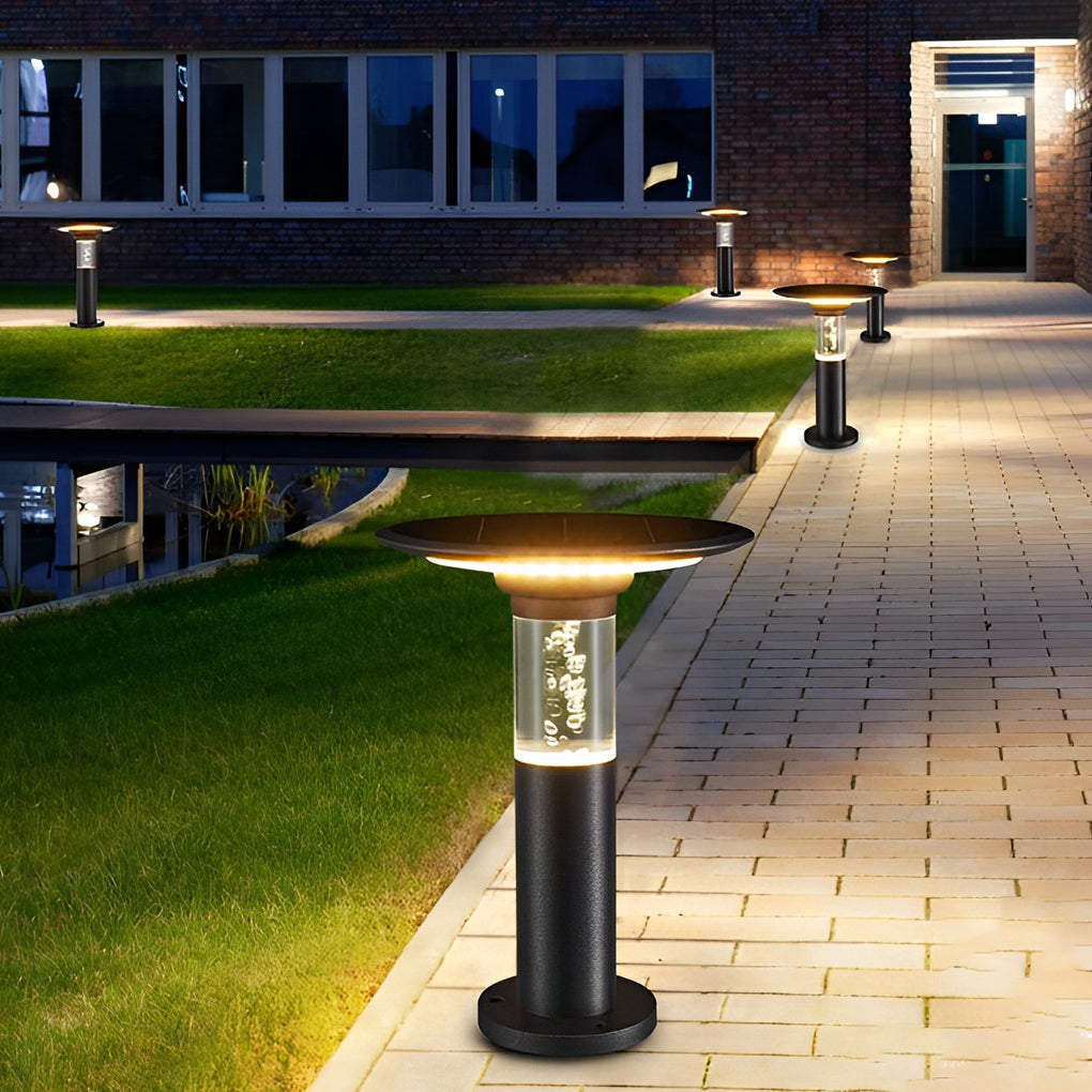 Black brass path lights providing elegant illumination for a contemporary landscape.
