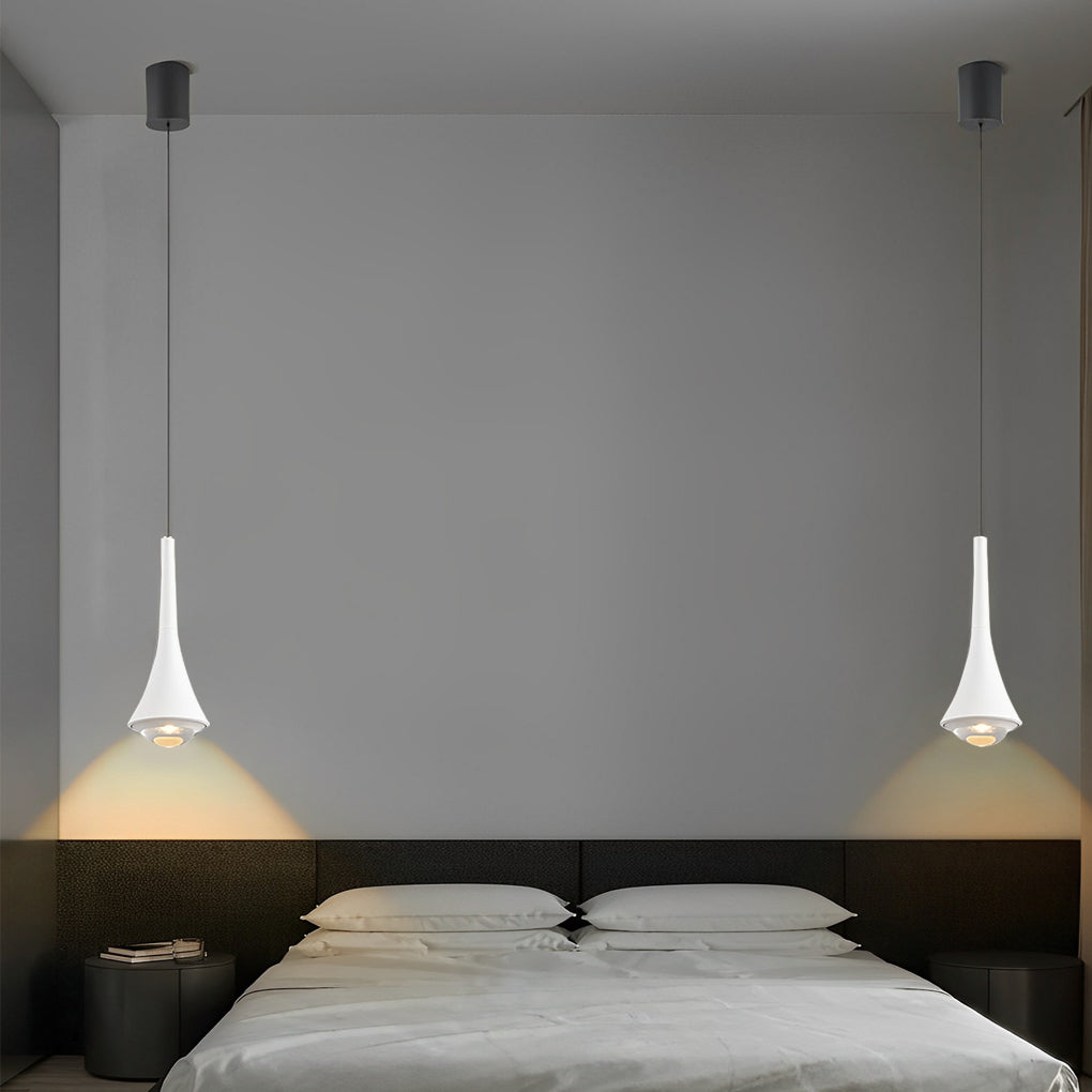 Black cone pendant lights installed symmetrically over a modern bedroom headboard.