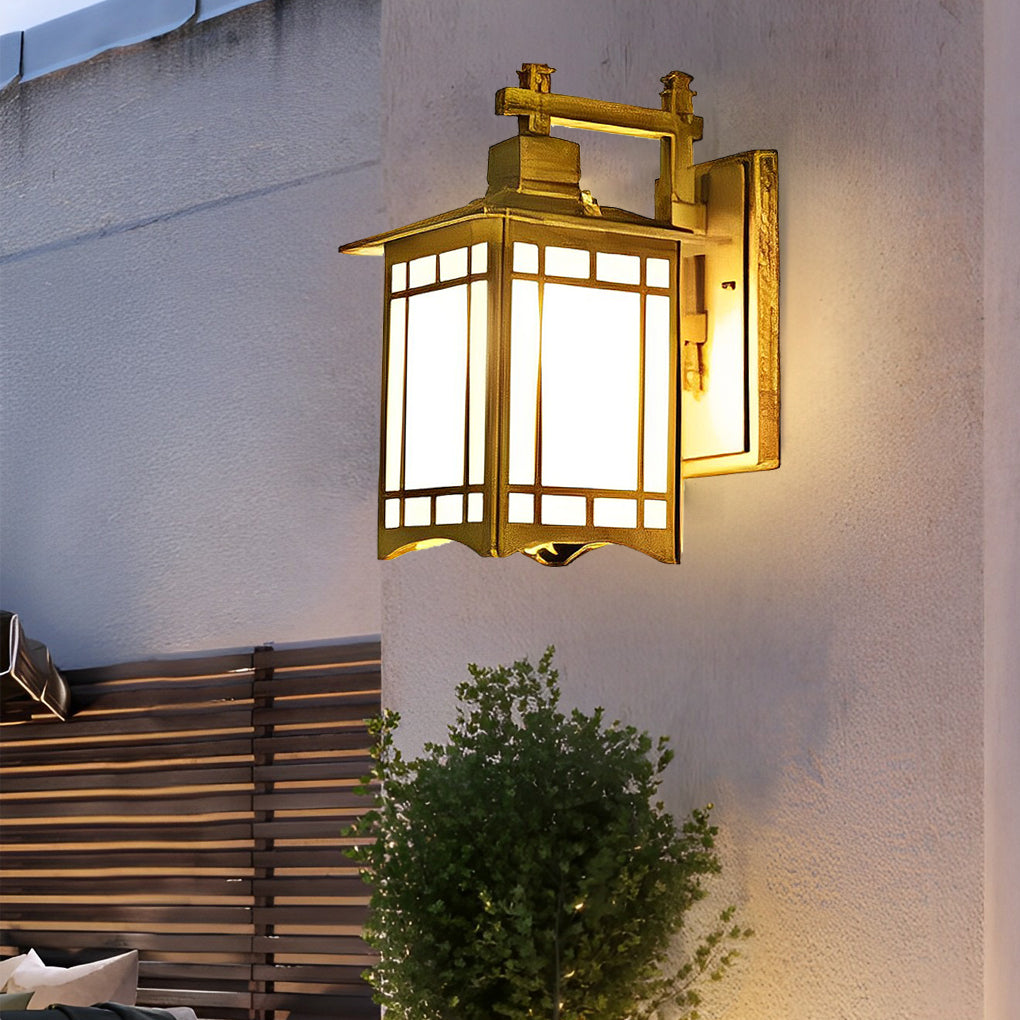 Lantern wall sconce with black frame and frosted glass panels on textured exterior wall.