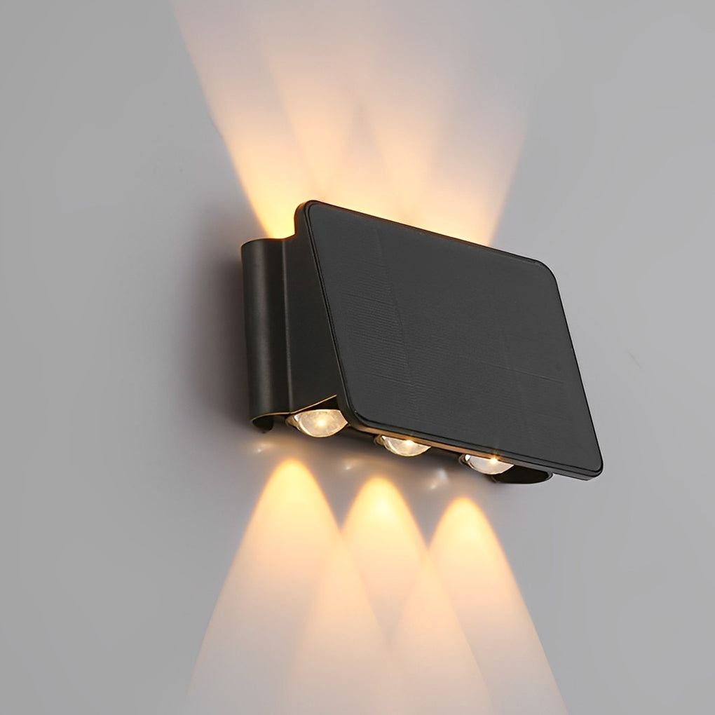 Wall sconce up and down light with black frame on white background.