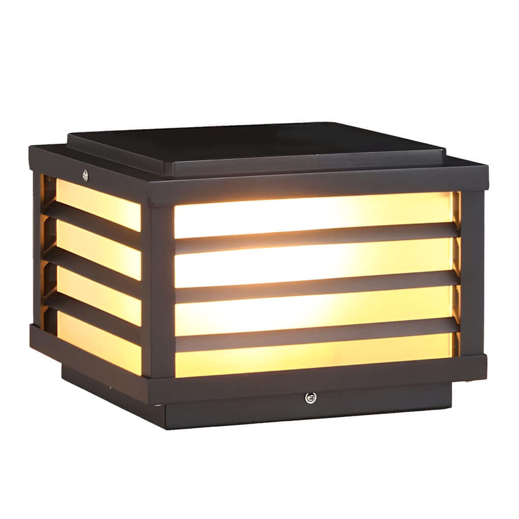 Black gate pillar light with a rectangular design, mounted on a stone pillar for elegant outdoor ambiance.
