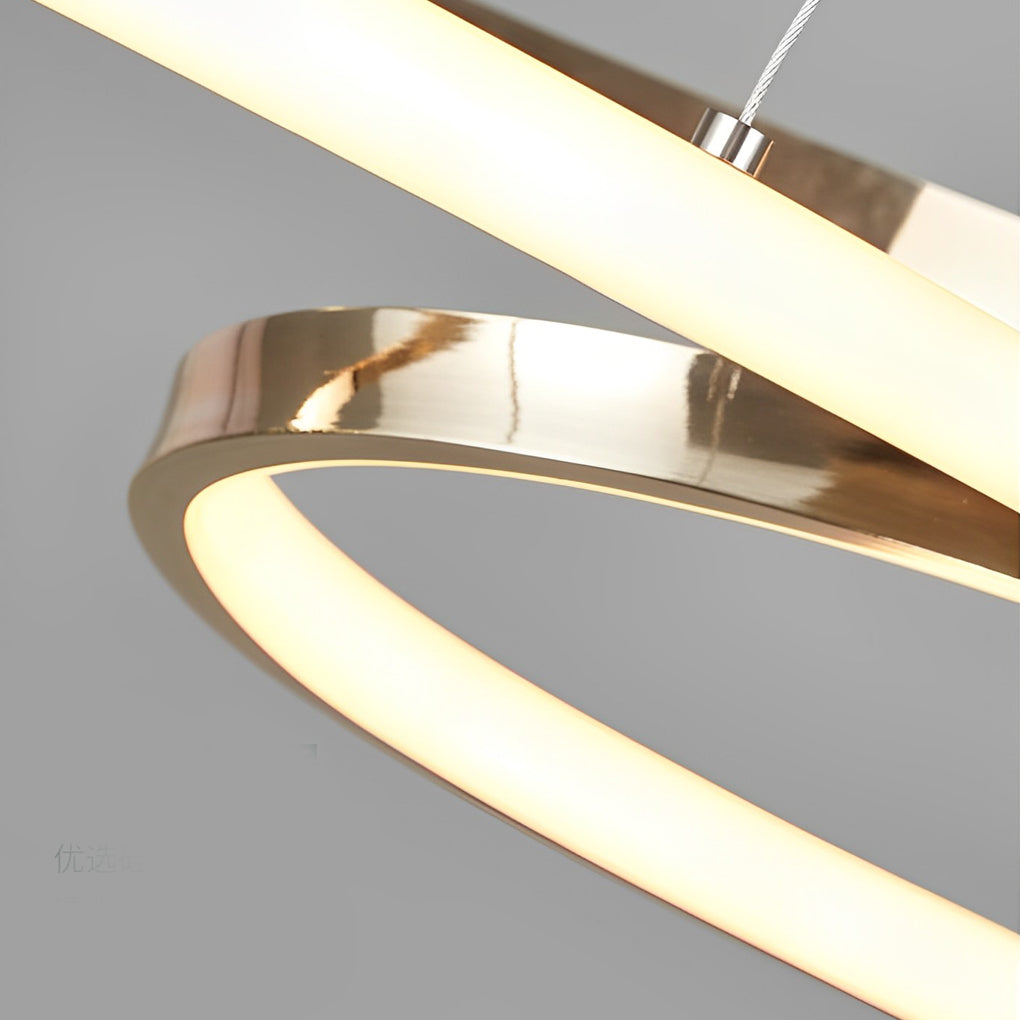 LED infinity chandelier with black and gold finish hanging above table.