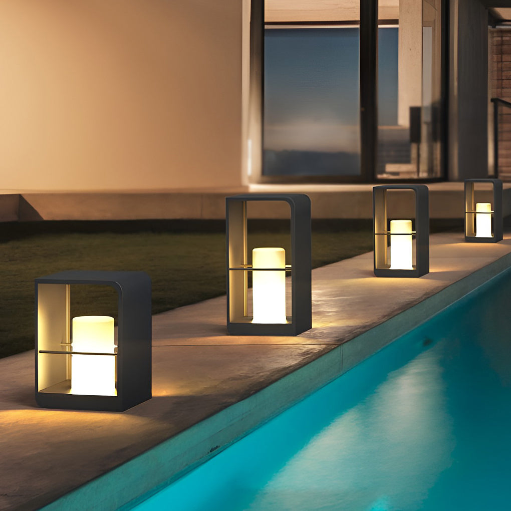 Black lantern outdoor light with sleek design, mounted near infinity pool for ambient lighting.