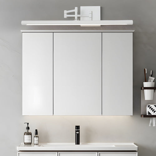 Black linear vanity light above a minimalist bathroom cabinet