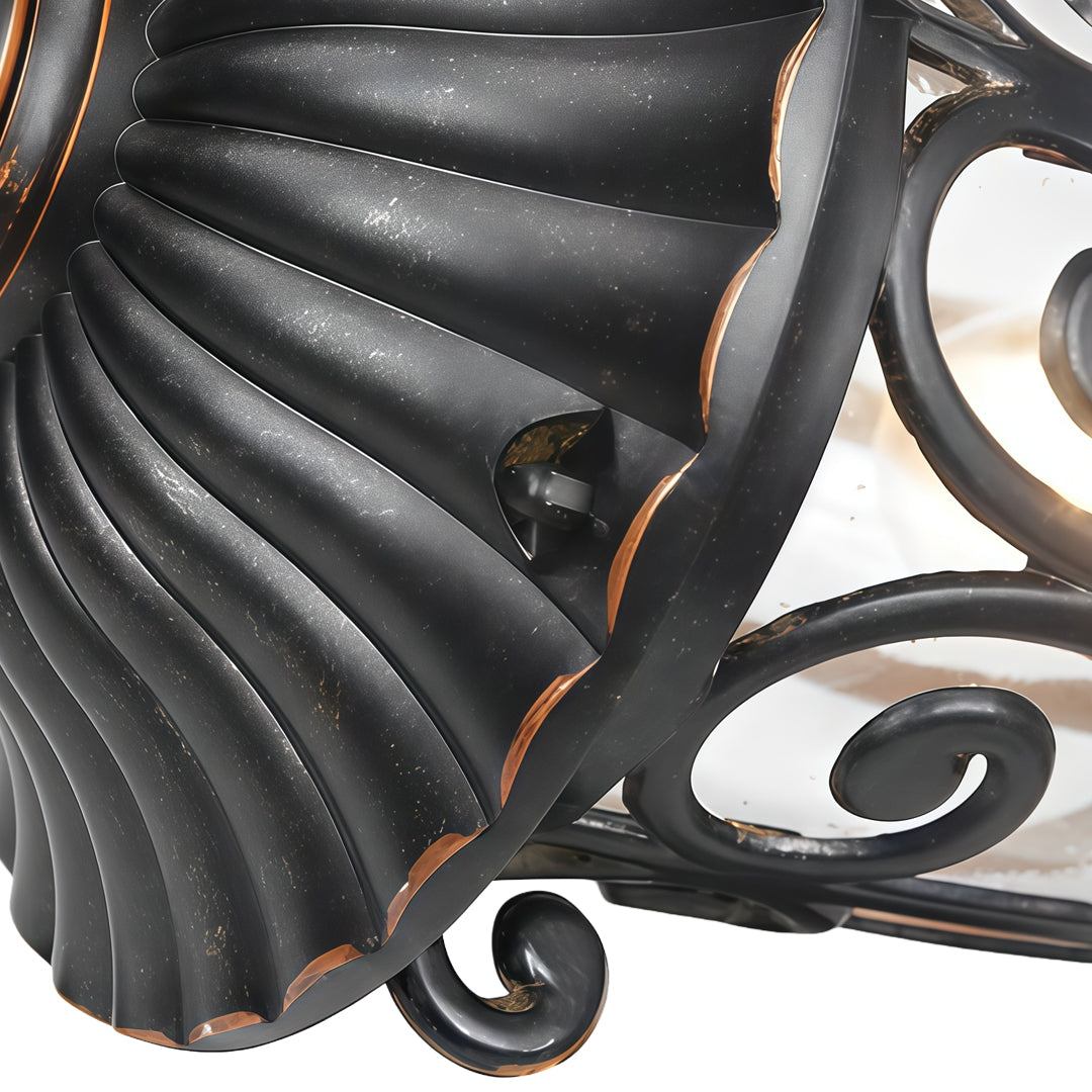 Black outdoor lantern sconce on a modern building, creating a contrast with contemporary architecture.